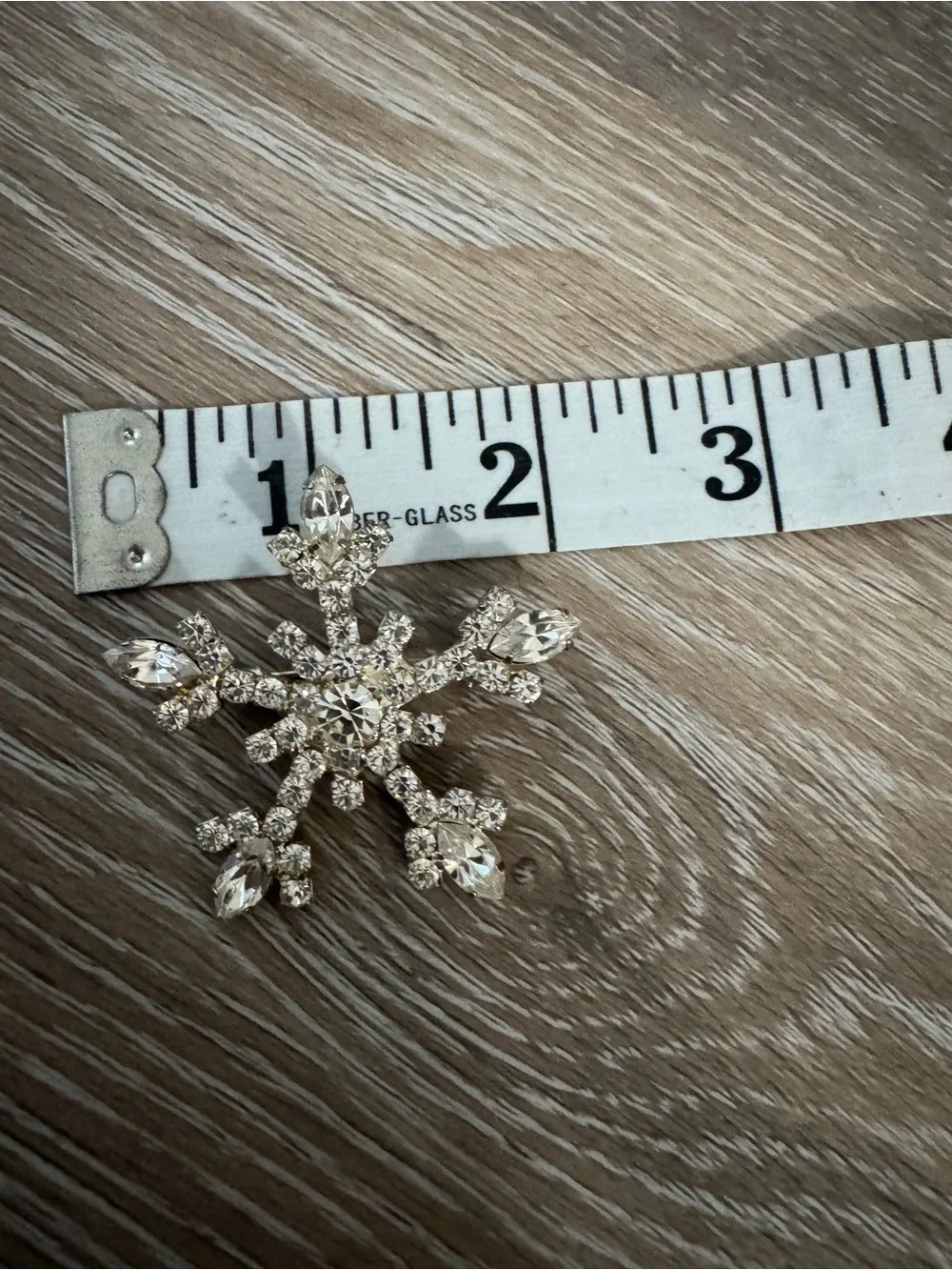 OTC vintage snowflake silver tone brooch with clear gemstones